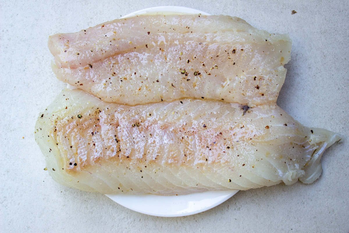 fresh fillets of cod on plate
