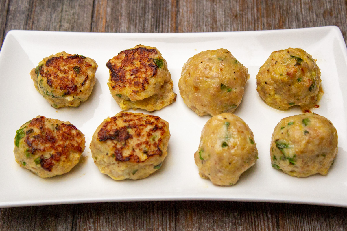 plate with 4 panfried meatballs on left and baked meatballs on right