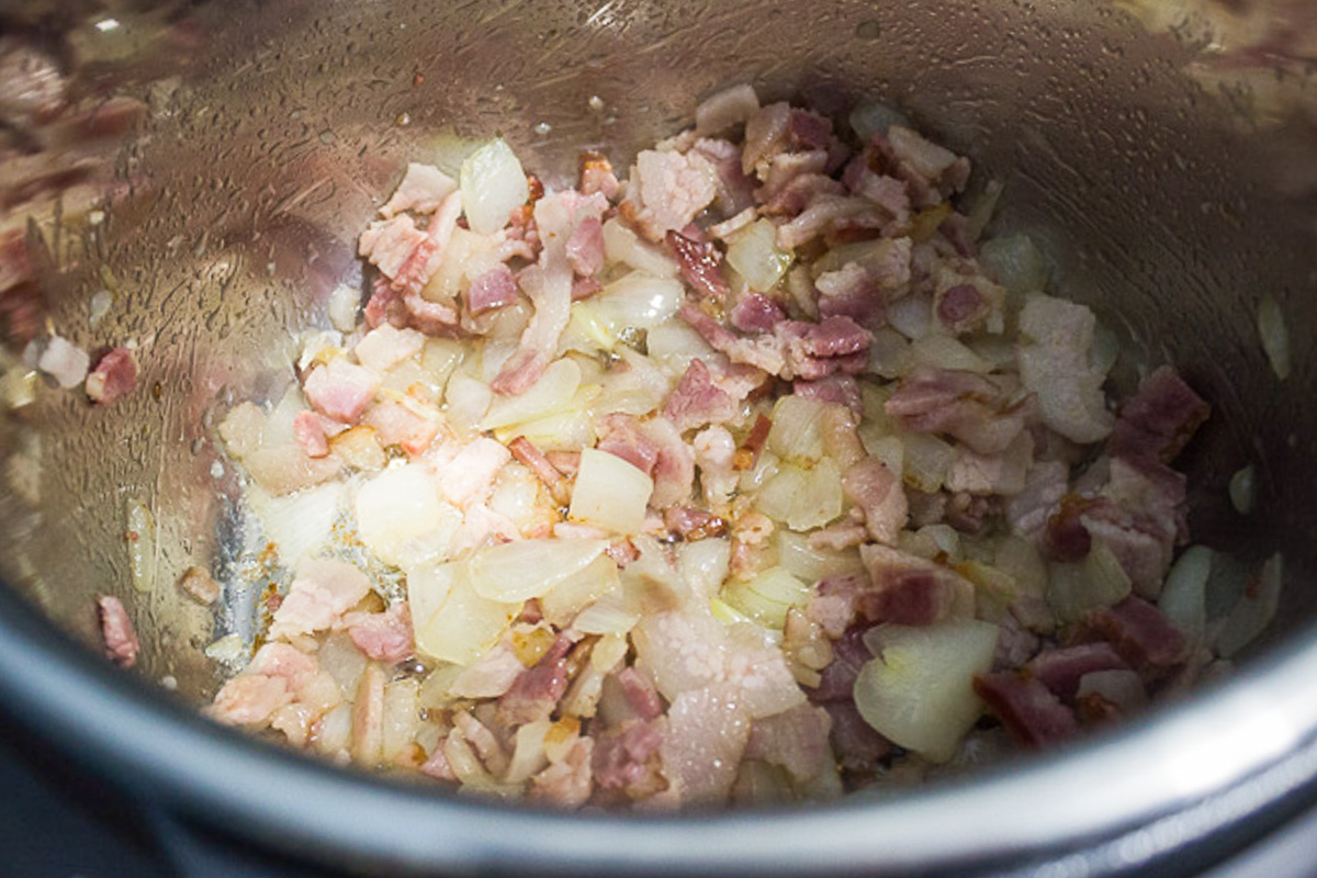 onions and bacon sauteing in instant pot.