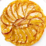 puff pastry apple tart inverted on plate