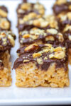 several peanut butter rice crispy treats in a row on plate