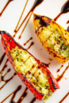two mini stuffed peppers with drizzle of balsamic direction