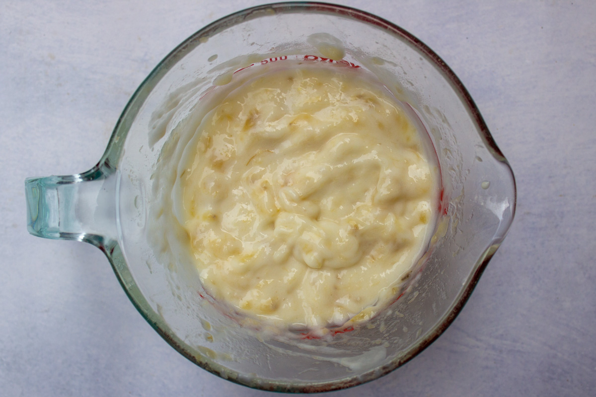 mashed banana mixture in measuring cup