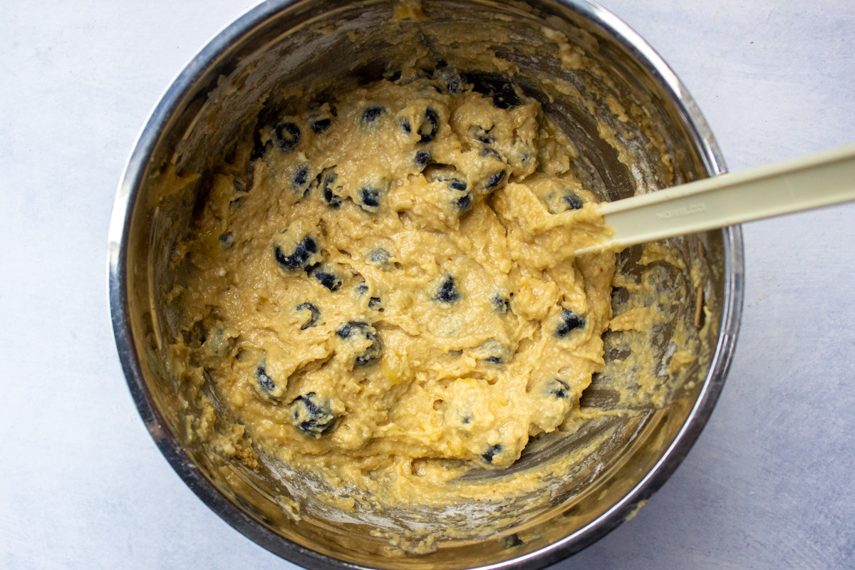 batter combined with blueberries in bowl
