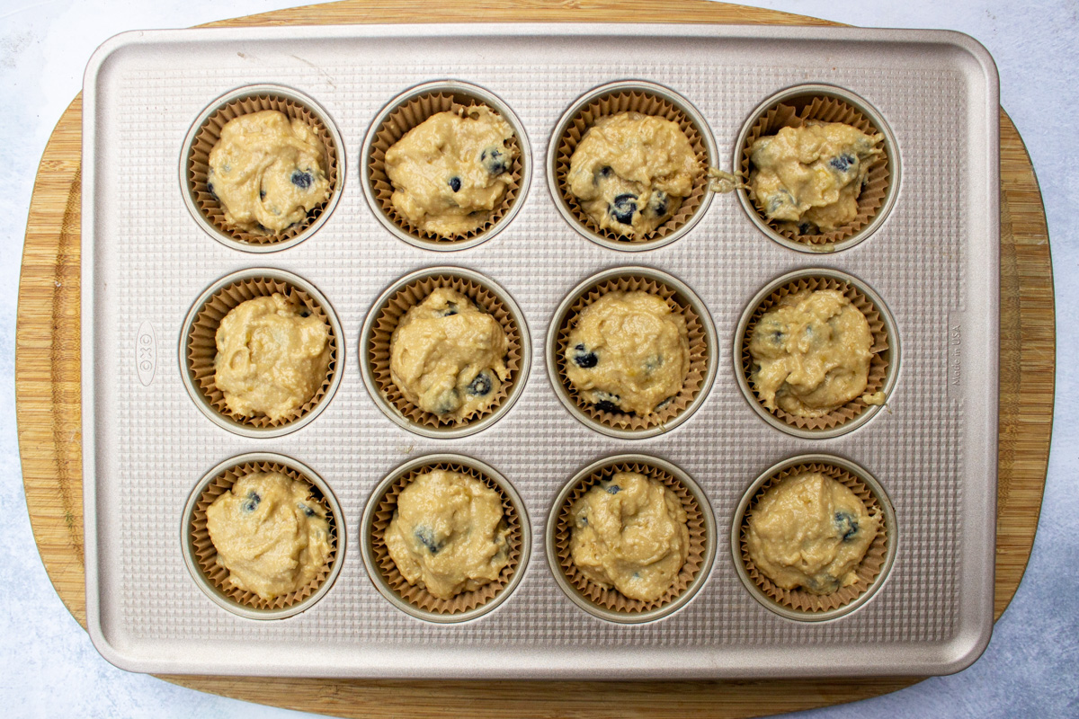 raw batter in muffin tins with liners.