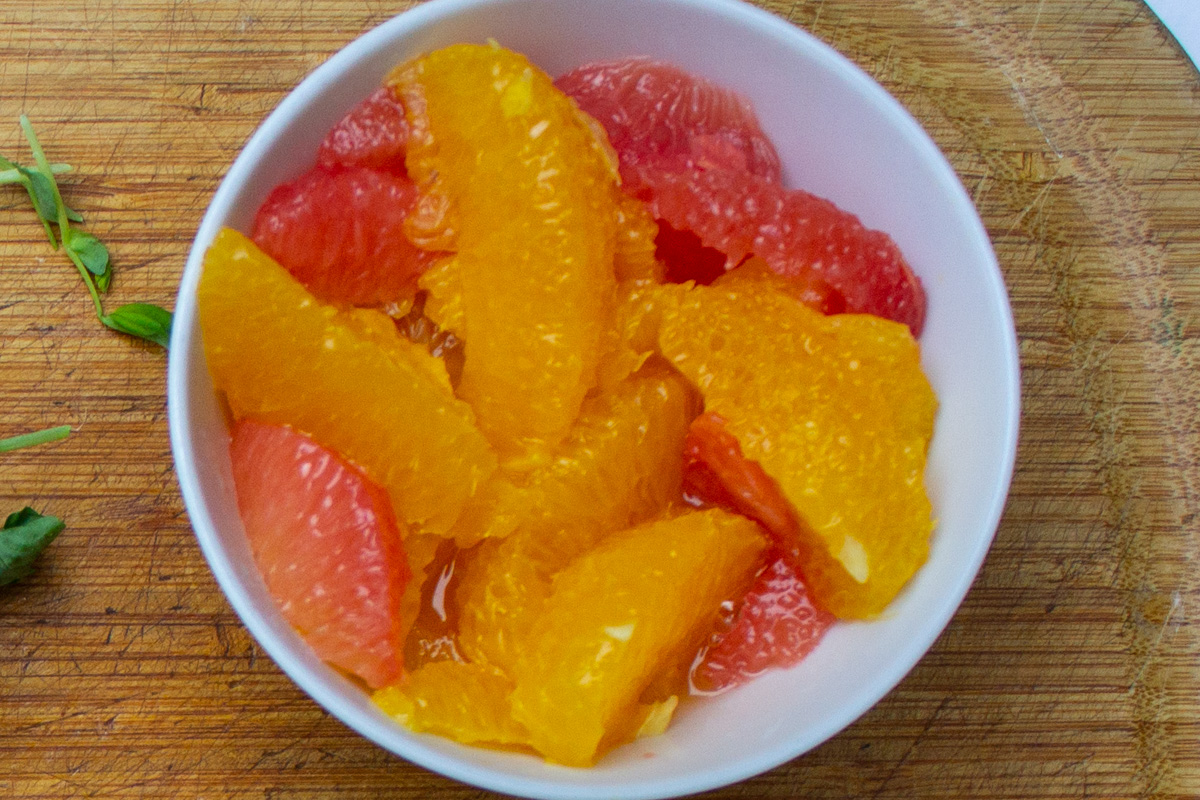 orange and grapefruit sections in a small bowl.