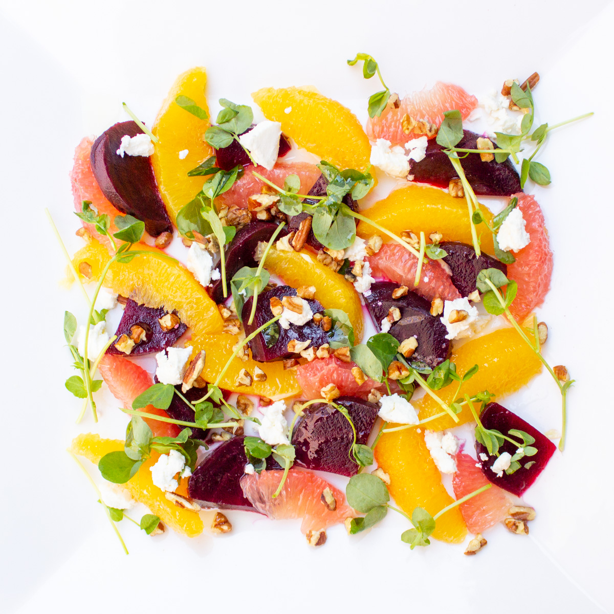 beetroot salad with oranges on white plate
