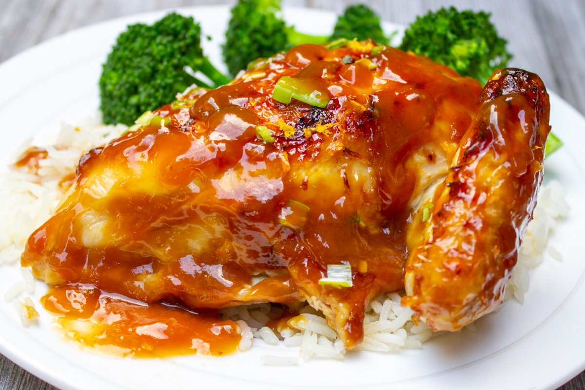 piece of chicken on plate with teriyaki glaze