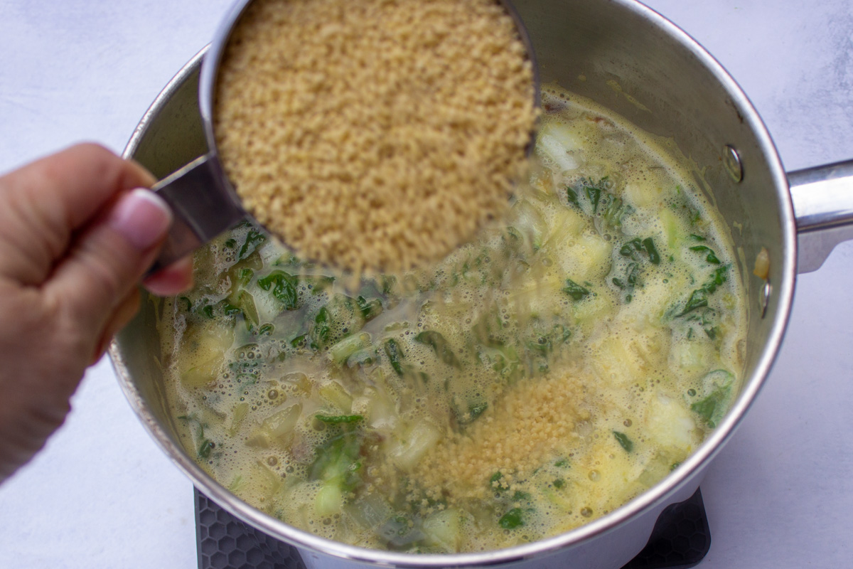pastina added to broth and veggies in pot