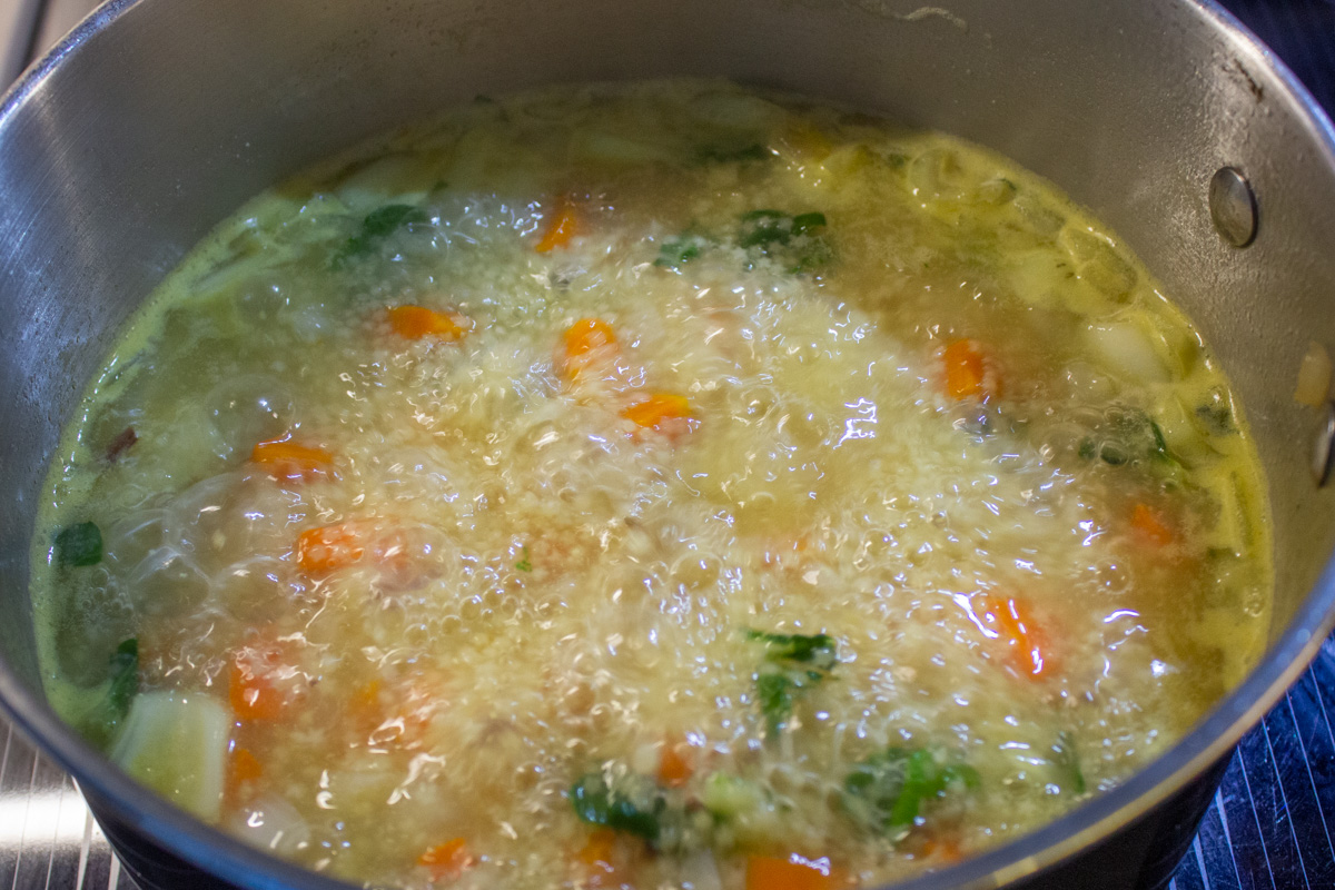 pastina soup cooking in pot on stove