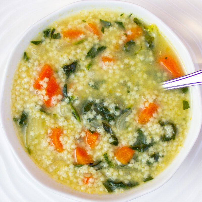 bowl of pastina soup on white plate
