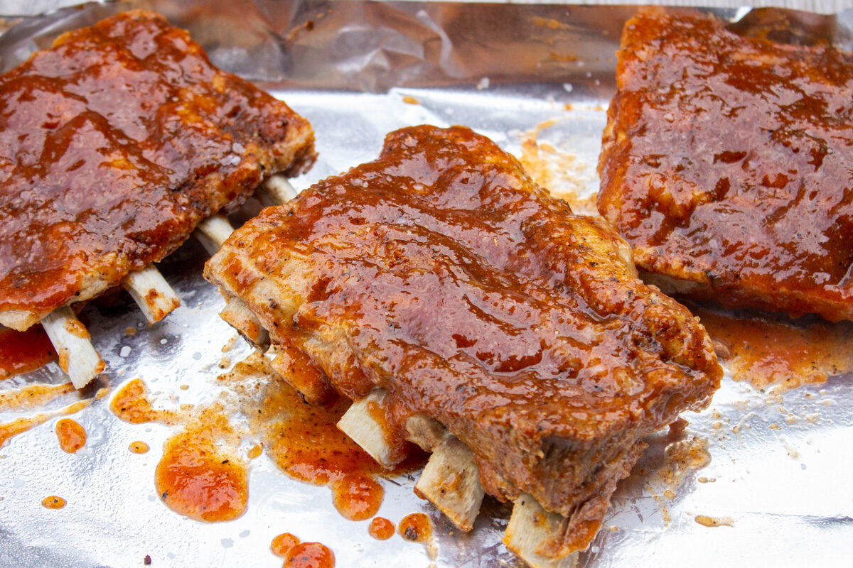 cooked rib pieces glazed before broiling