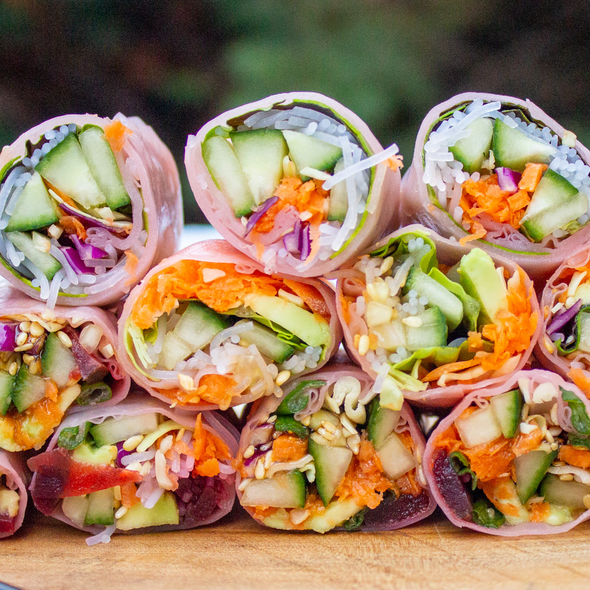 rice paper rolls cut in thirds and piled on cutting board