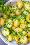 parsley potatoes with zest in white bowl