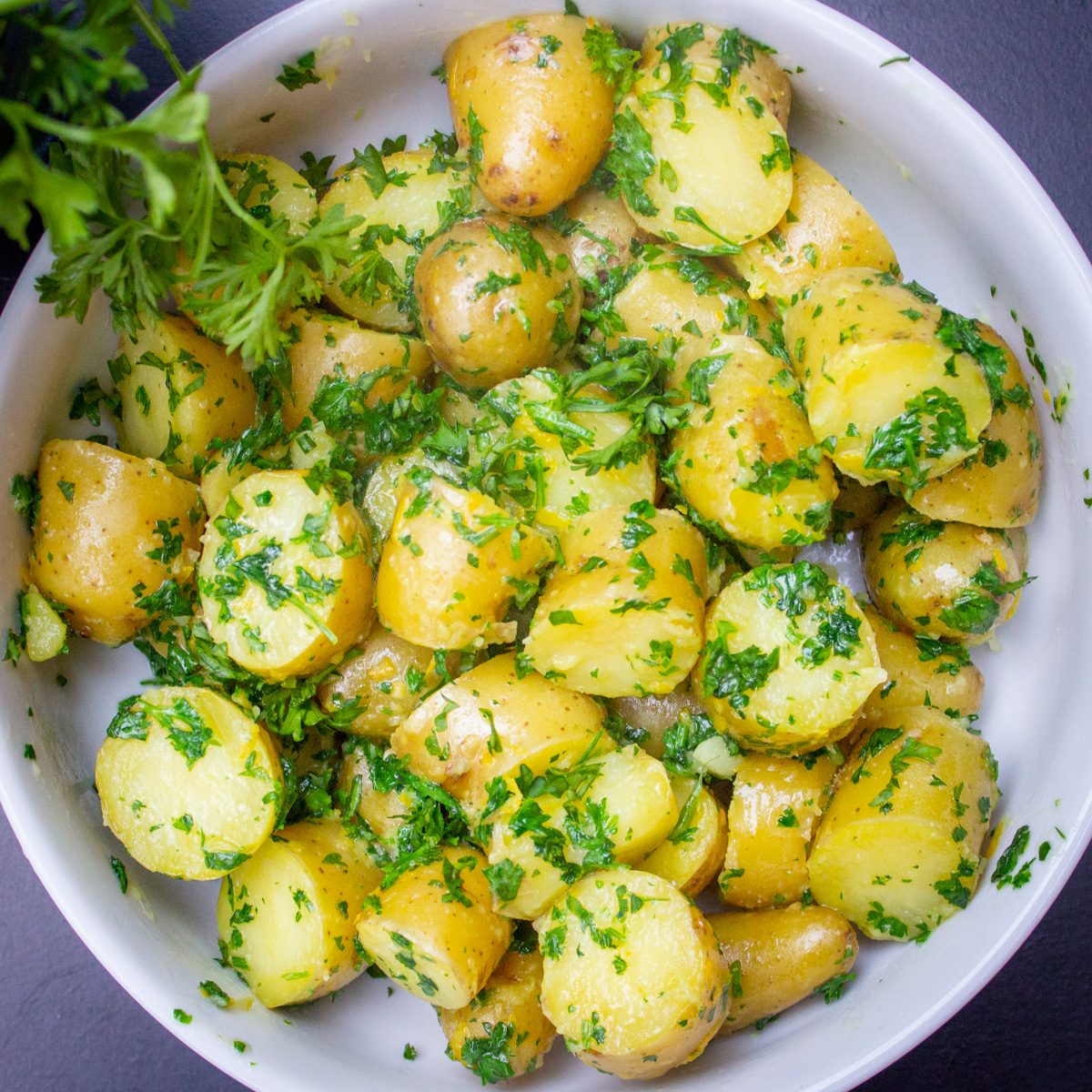 parsley potatoes in white bowl