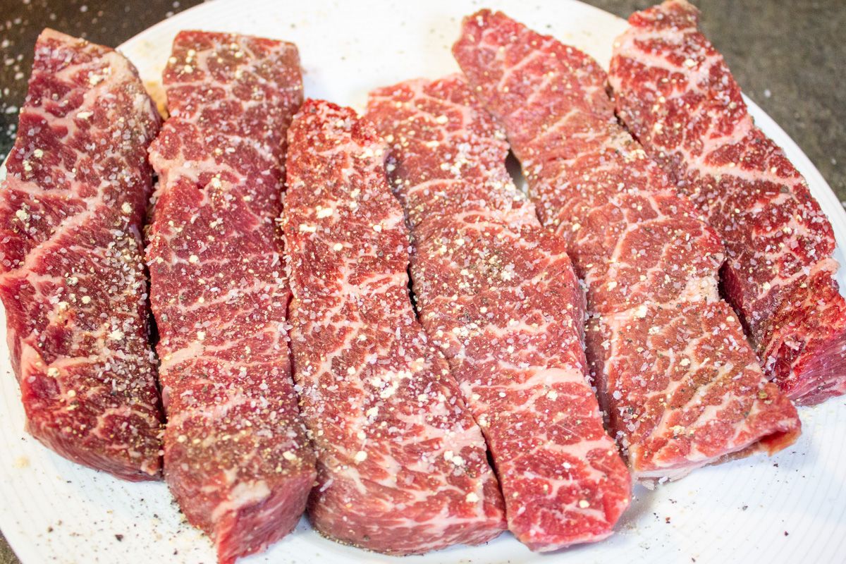 6 boneless beef short ribs on plate seasoned