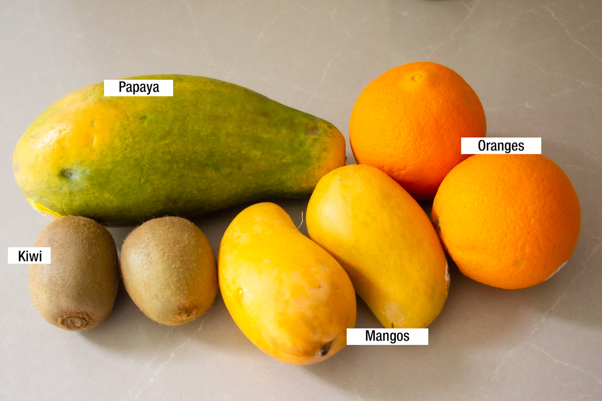 whole fresh mango, kiwi, papaya, oranges.
