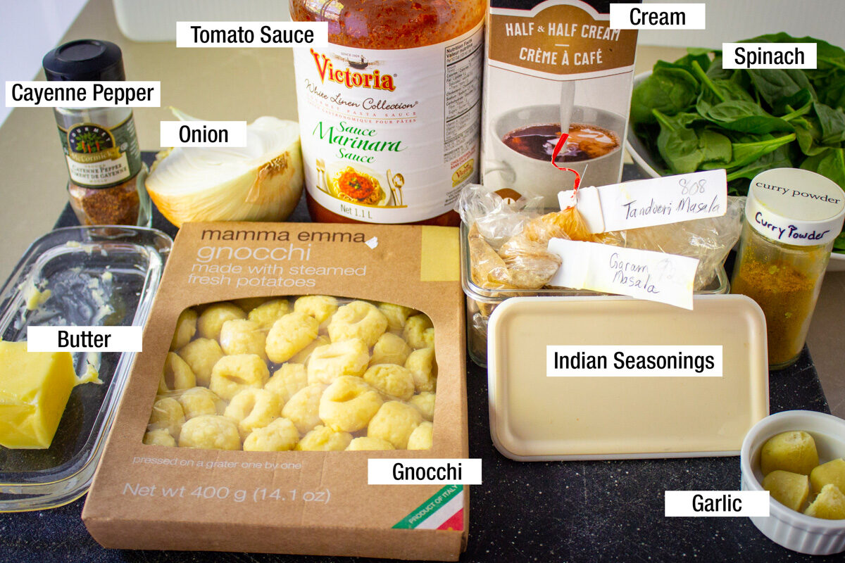 packaged gnocchi, tomato sauce, cream, indian seasonings, spinach, butter, onion