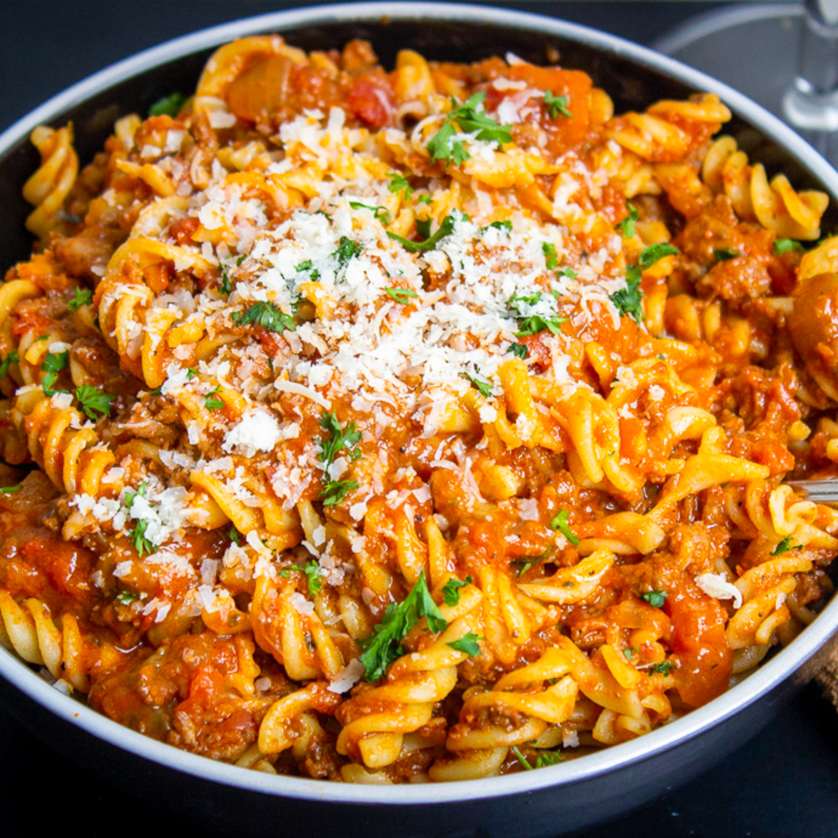 vegan bolognese with fusilli pasta in bowl