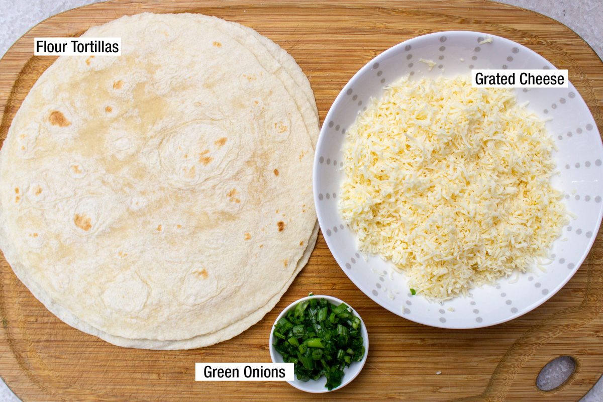 tortillas, grated cheese, chopped green onions