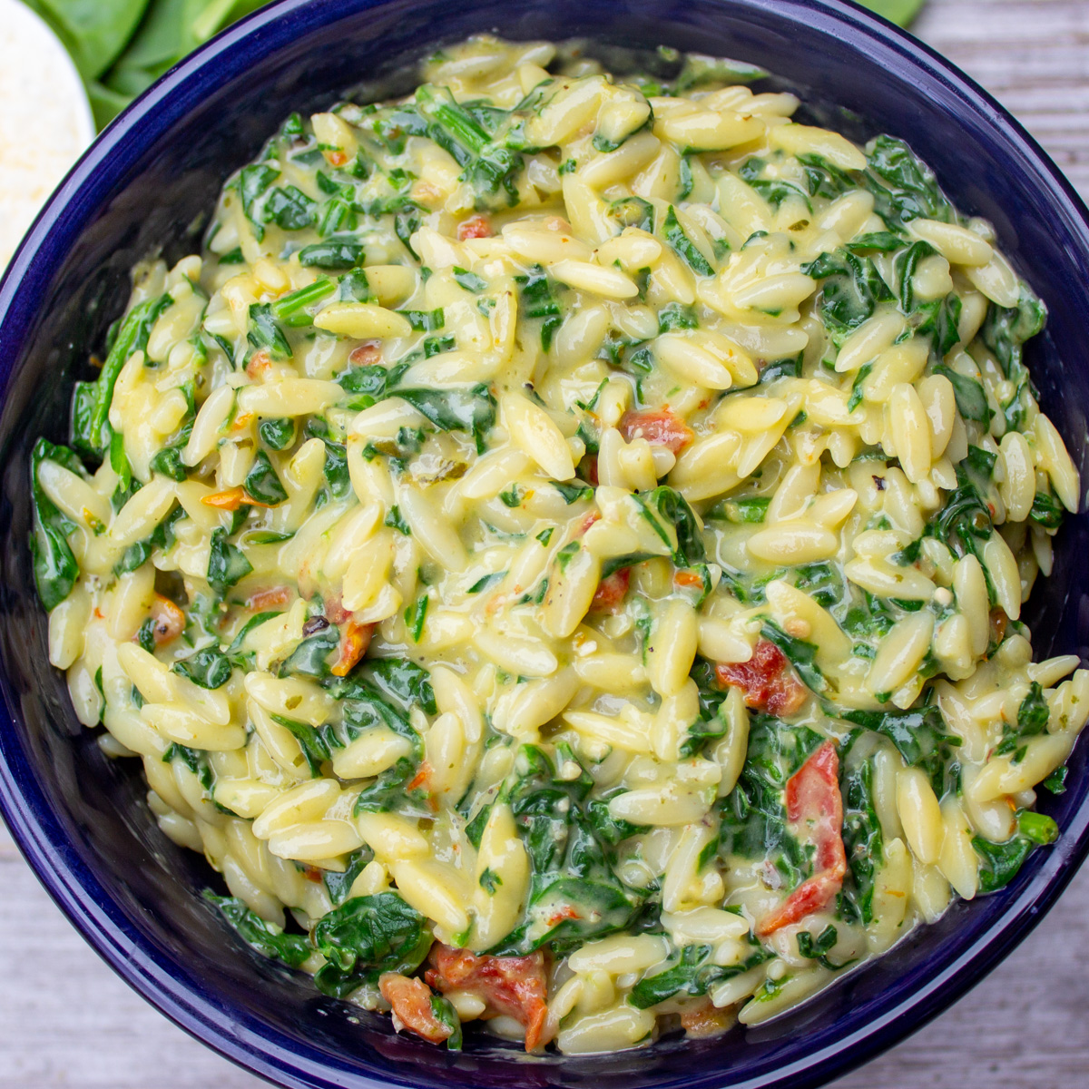 bowl of parmesan orzo with spinach