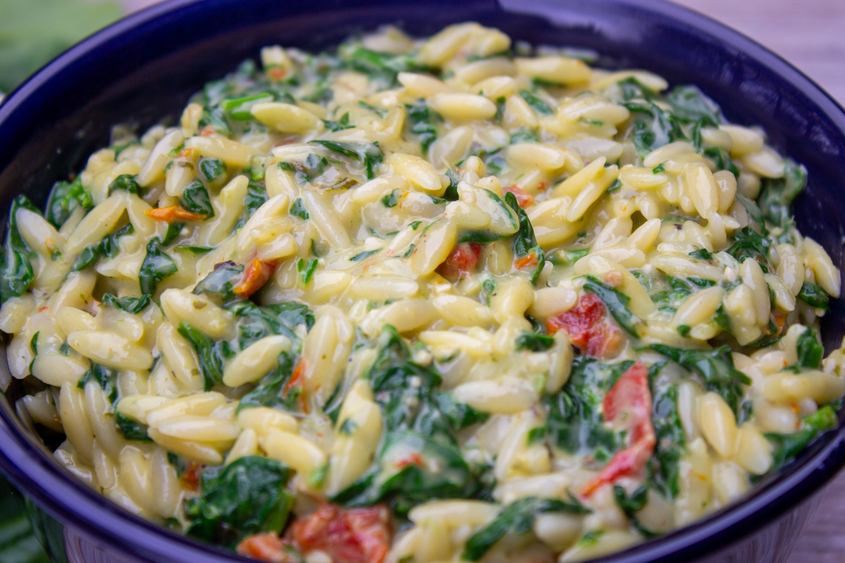 orzo with spinach and parmesan in bowl