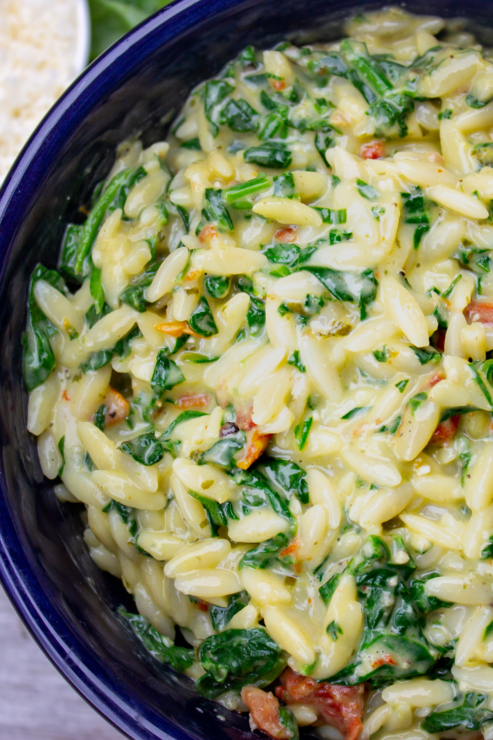 bowl of parmesan orzo with spinach