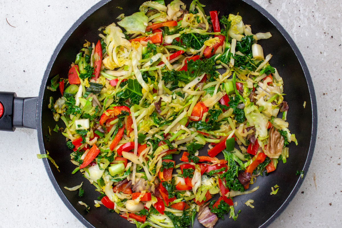 sauteed slaw and veggies in skillet.