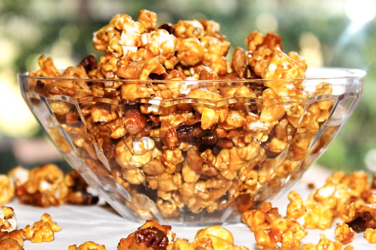 caramel popcorn in clear plastic bowl.