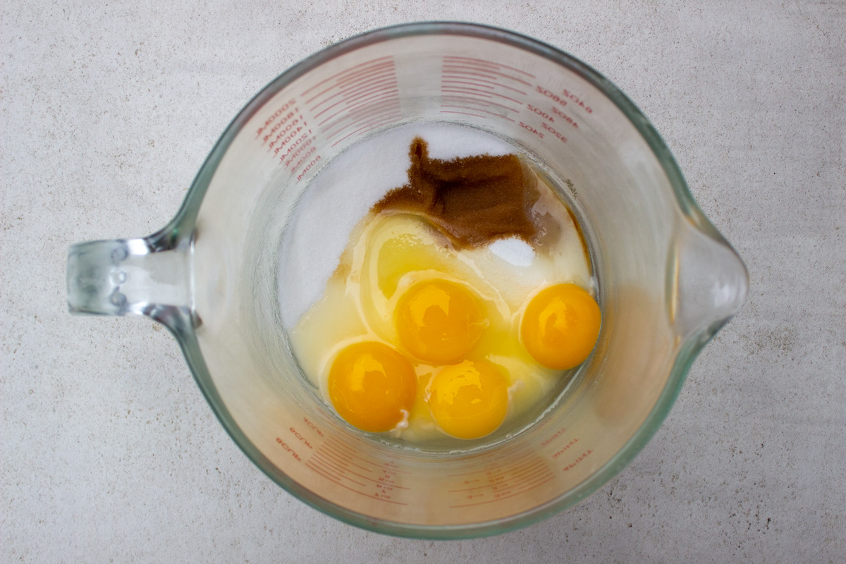 eggs, sugar, vanilla in mixing bowl.