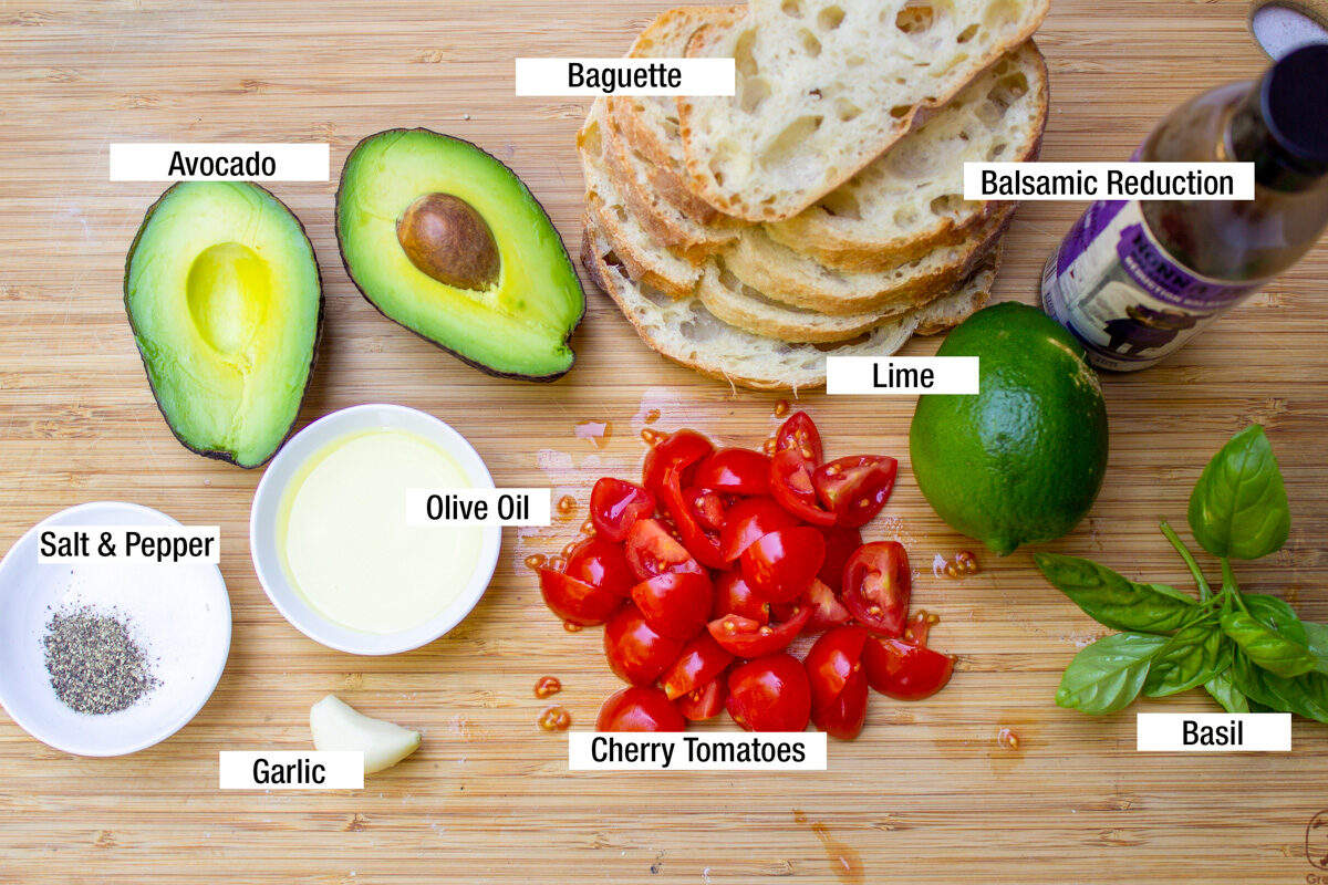 avocado, sliced bread, chopped cherry tomatoes, lime, balsamic reduction, basil leaves, salt, pepper, garlic, olive oil.