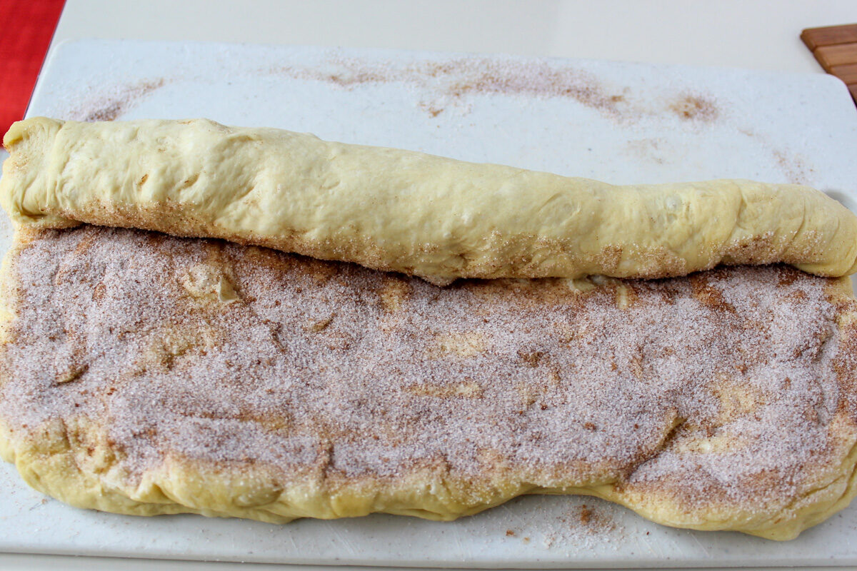 partially rolled dough with sugar-butter mixture inside.