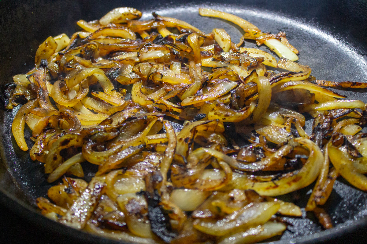 charring onions in a skillet.