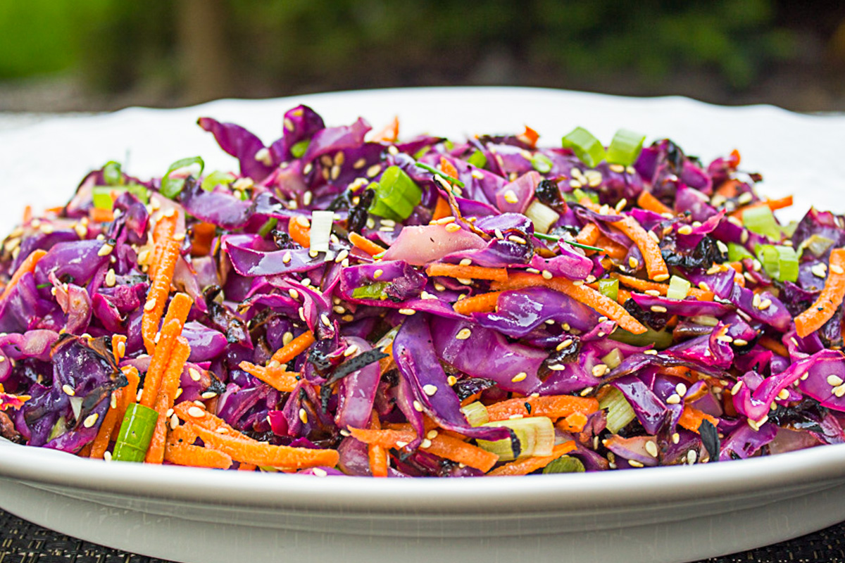 grilled purple cabbage slaw on white plate.