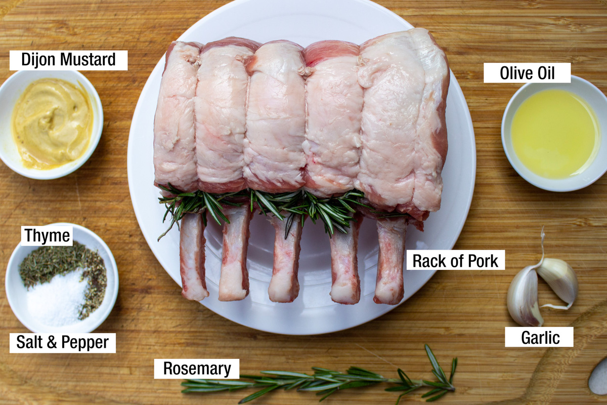 uncooked rack of pork, Dijon, olive oil, garlic, rosemary, seasonings.