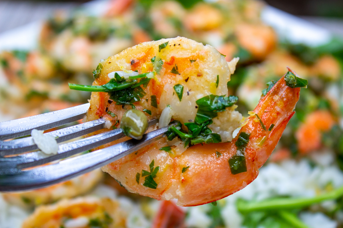 single picatta shrimp on fork.