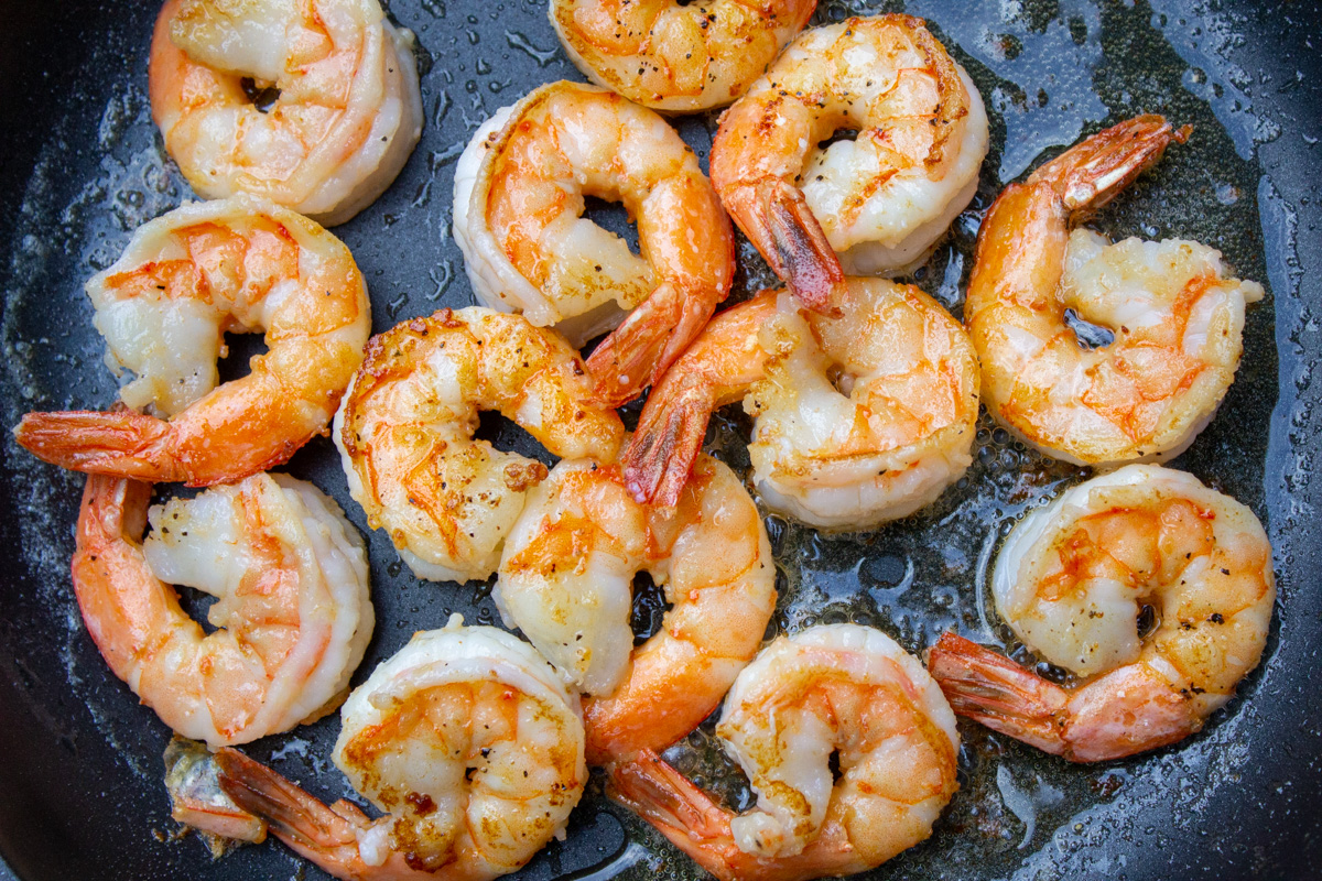 shrimp sauteed in pan.