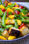 panzanella salad with charred snap peas in bowl.