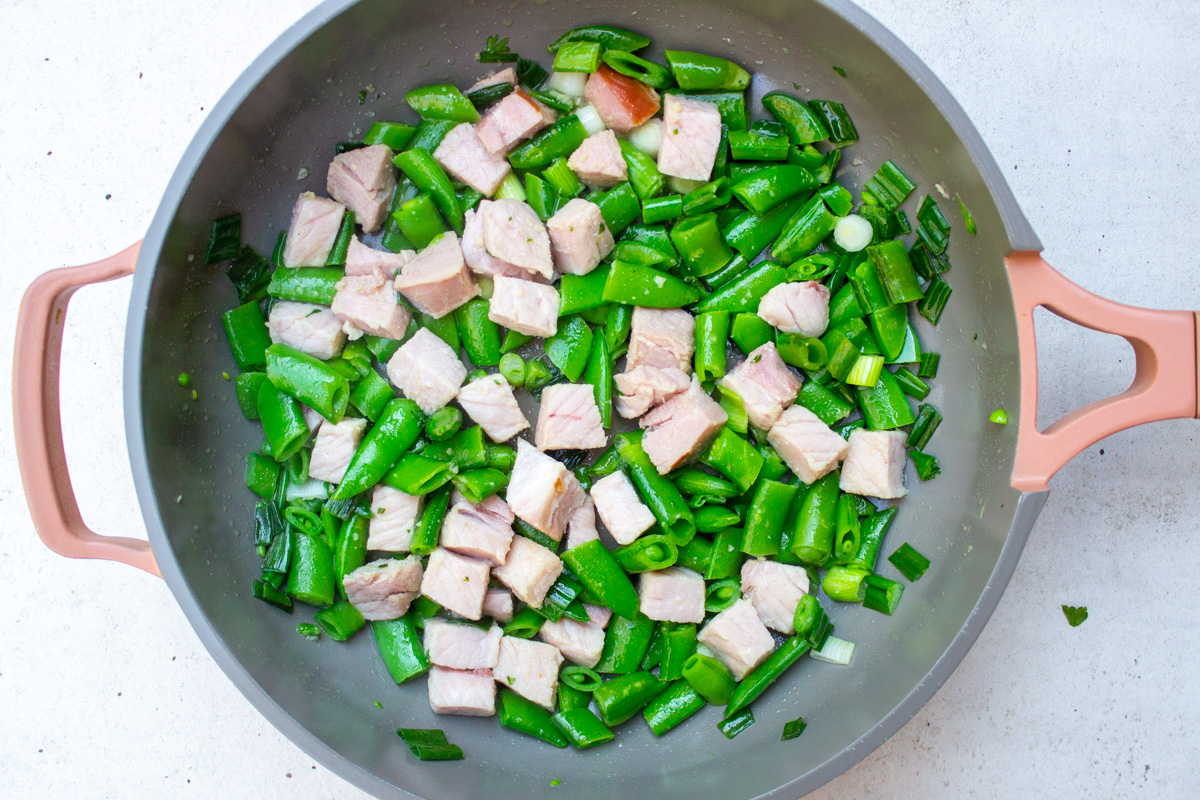 ham, snap peas and green onions in skillet.