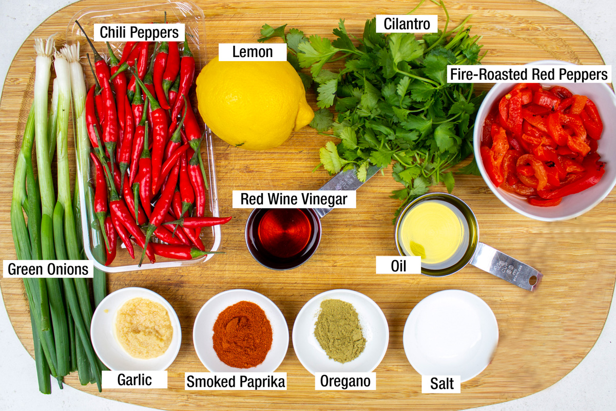 Thai chili peppers, lemon, red wine vinegar, cilantro, jarred roasted red peppers, oil, garlic, smoked paprika, oregano, salt.