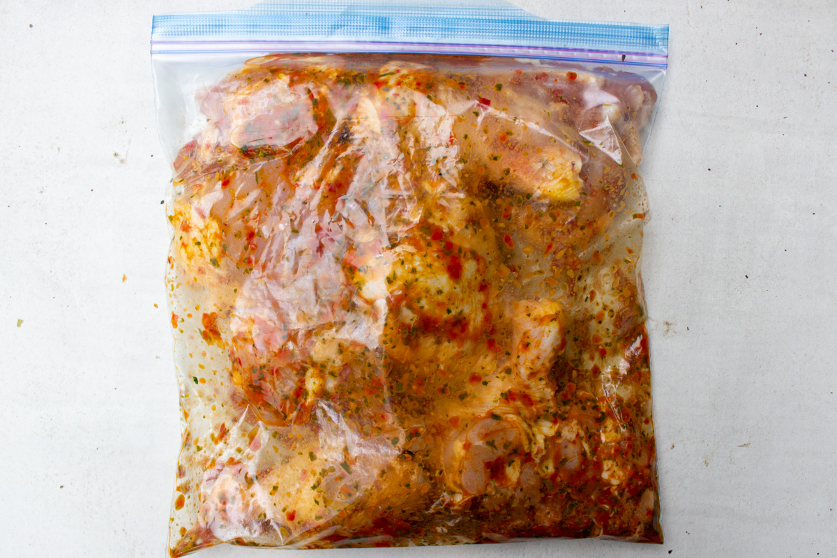 chicken in ziploc with peri peri sauce.