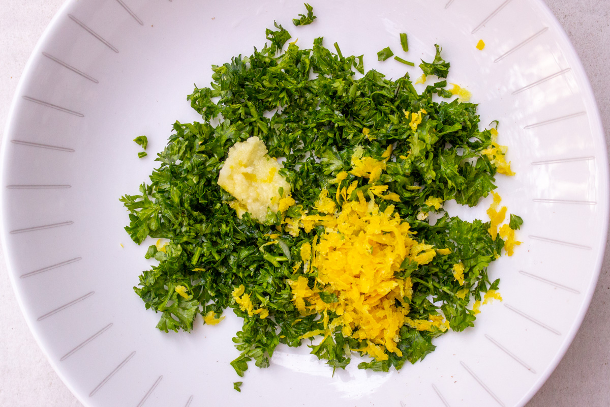 bowl with chopped parsley, lemon zest and minced garlic.