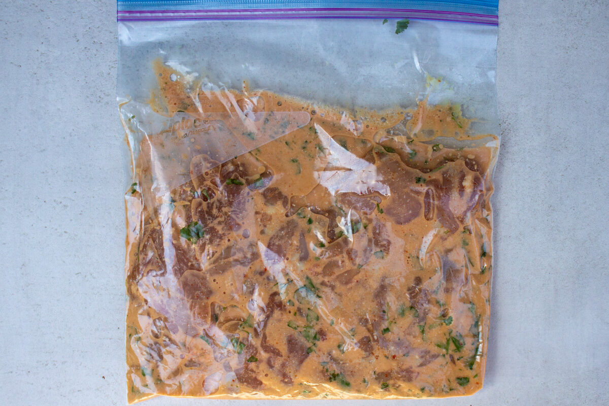 thigh in Thai chicken marinade in ziploc bag.