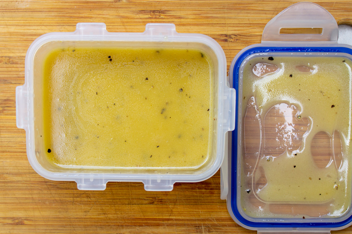 blended honey lemon salad dressing in plastic container.
