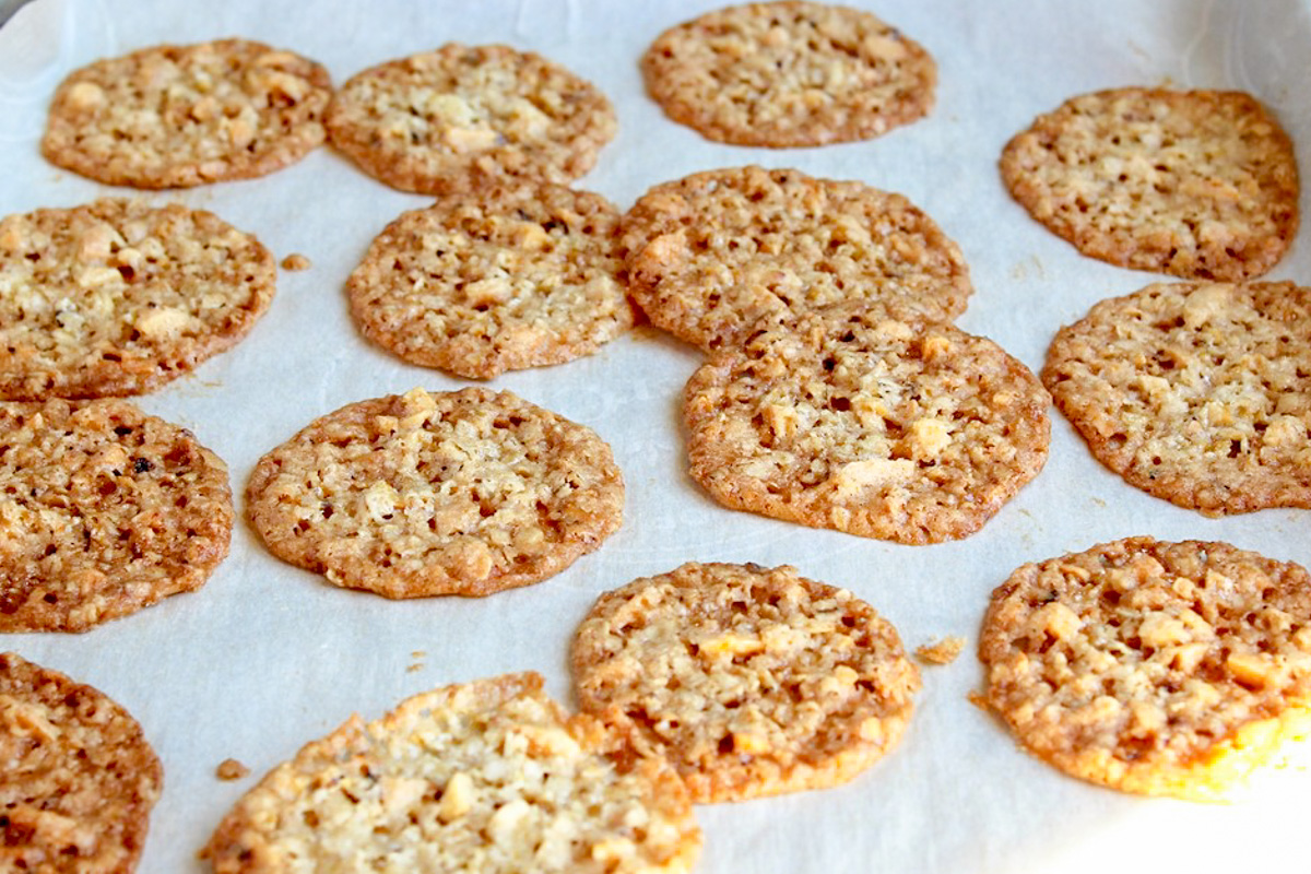 oatmeal lace cookies on baking sheet.
