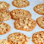 oatmeal lace cookies on baking sheet.