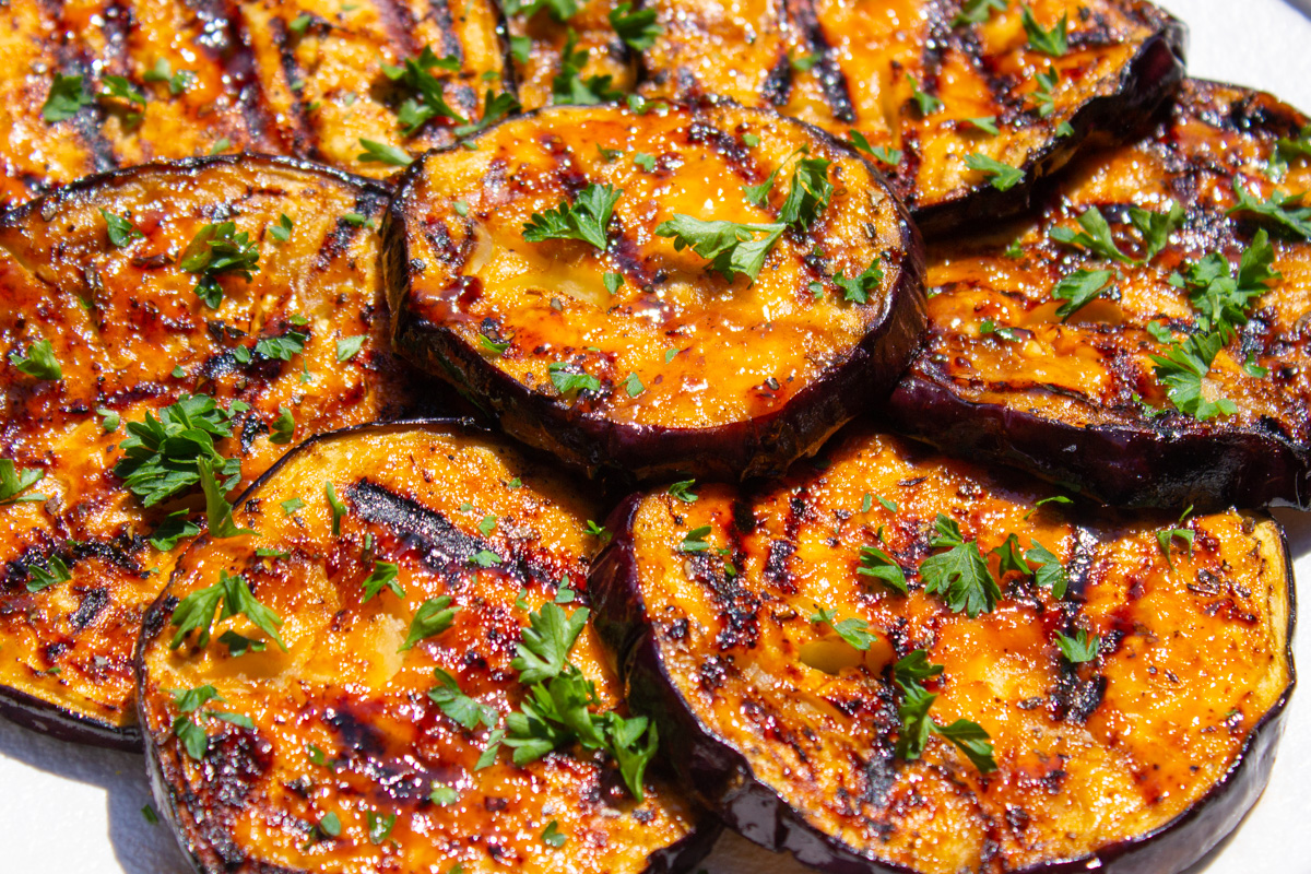 glazed grilled eggplant on plate.