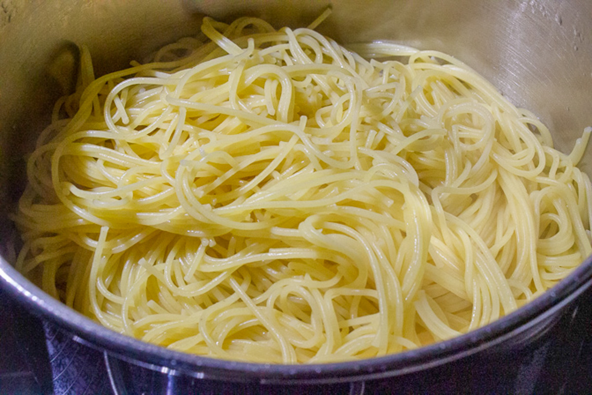 cooked, drained spaghetti in pot. 