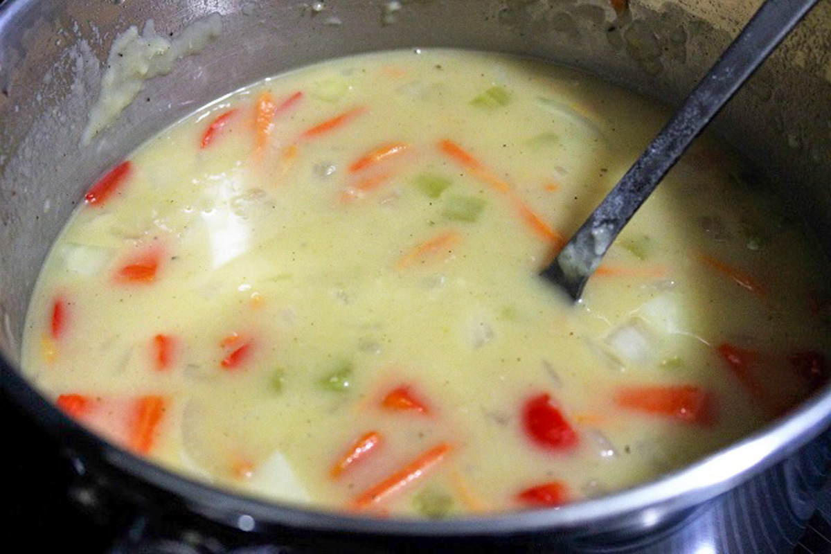 chowder thai style in pot with veggies.