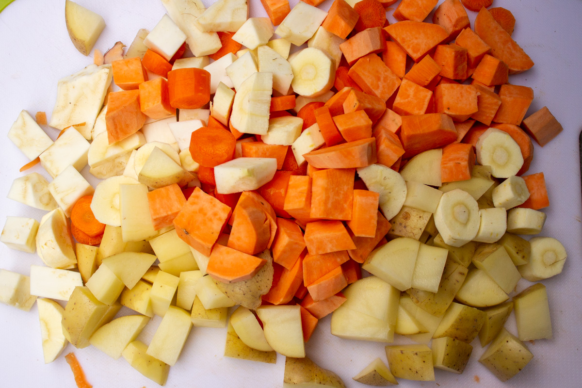 diced root vegetables on cutting board.